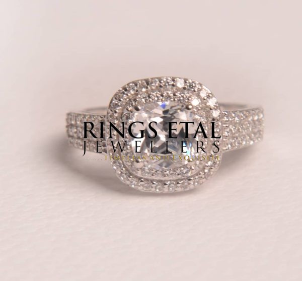 Topsy white gold engagement ring in 18karats gold with Cubic zirconia side and centre stones
