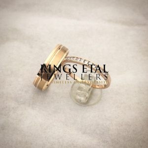 His and Hers wedding bands in 18 karats gold, the two bands together.
